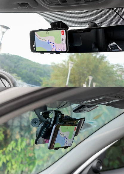 Car phone holder with smartphone displaying navigation app, mounted on car dashboard and windshield.