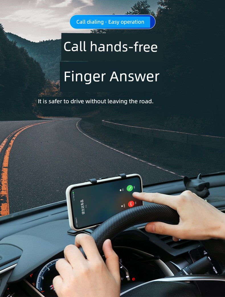 Person using a phone mount on a car dashboard with a scenic road in the background